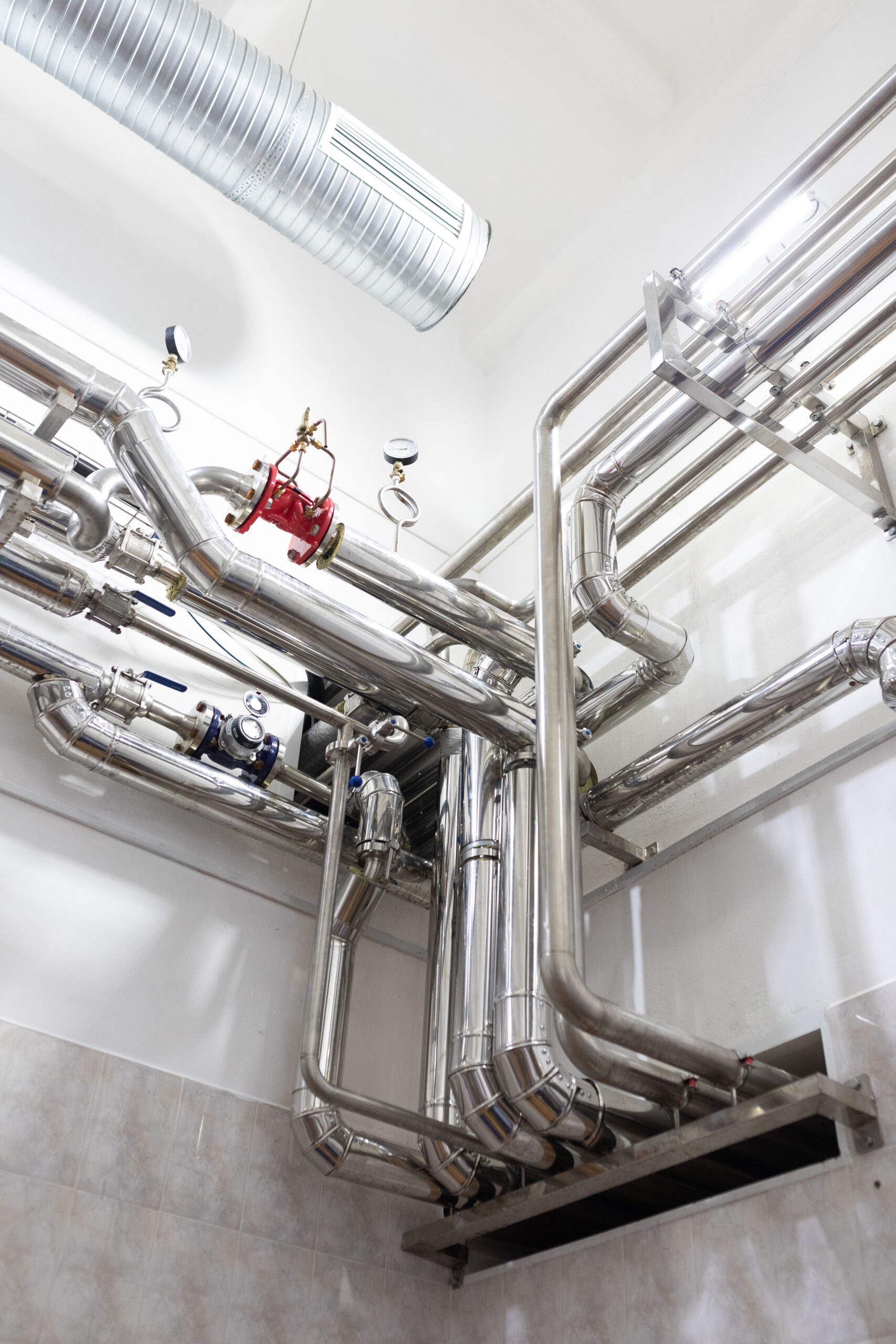 Modern industry equipment, cables and piping inside in manufacture background